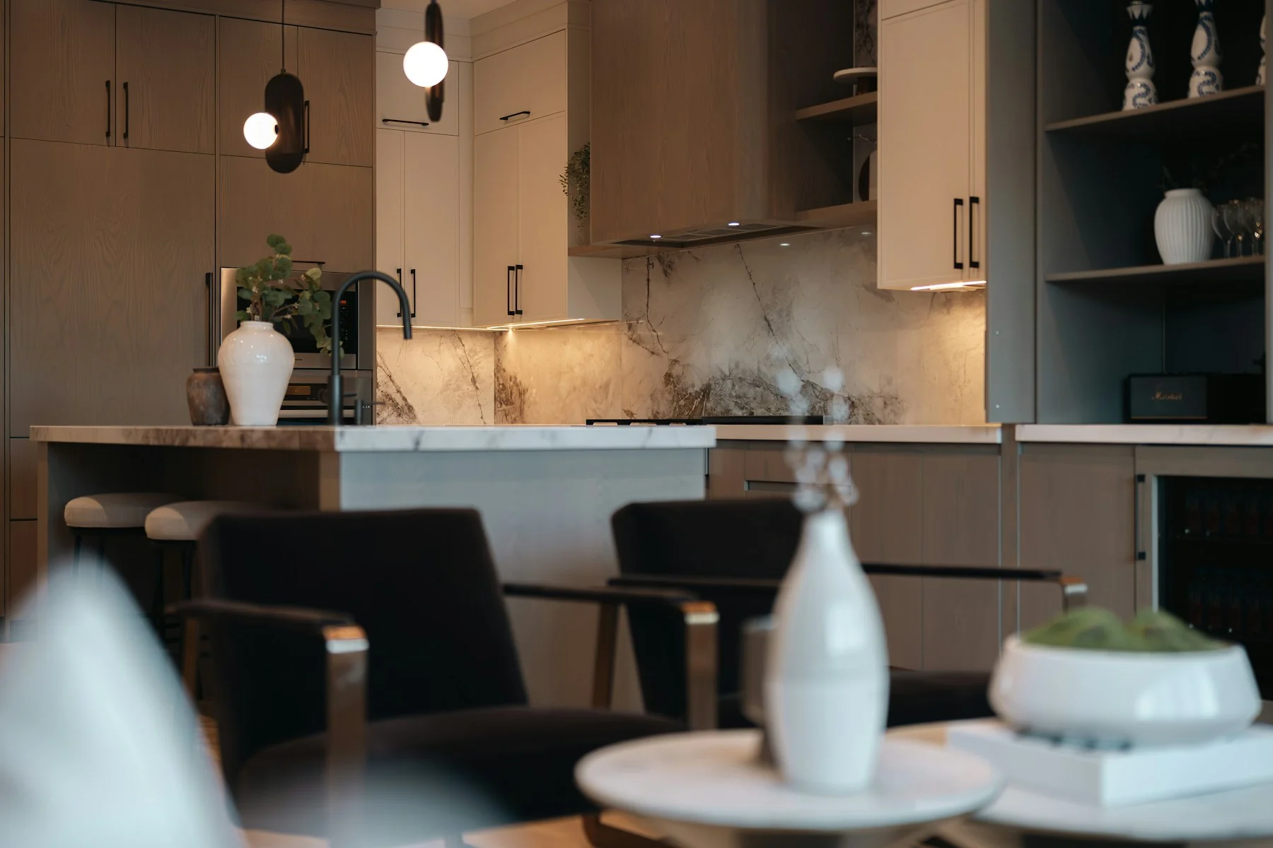 Warm cabinetry and stone finishes in a residential kitchen